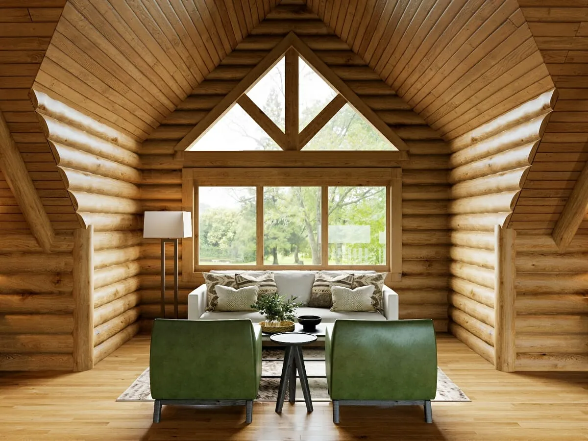 A cozy log cabin living room interior with green leather armchairs, a white sofa, and a peaked window framing forest views